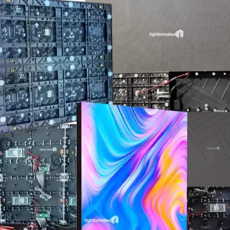 Rear view of modular LED video wall panels showing exposed circuit boards, power cables, and mounting brackets arranged in a grid structure.